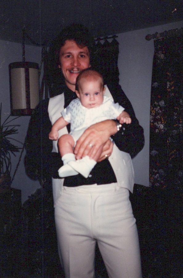 Mike holding infant Shane, 1982
