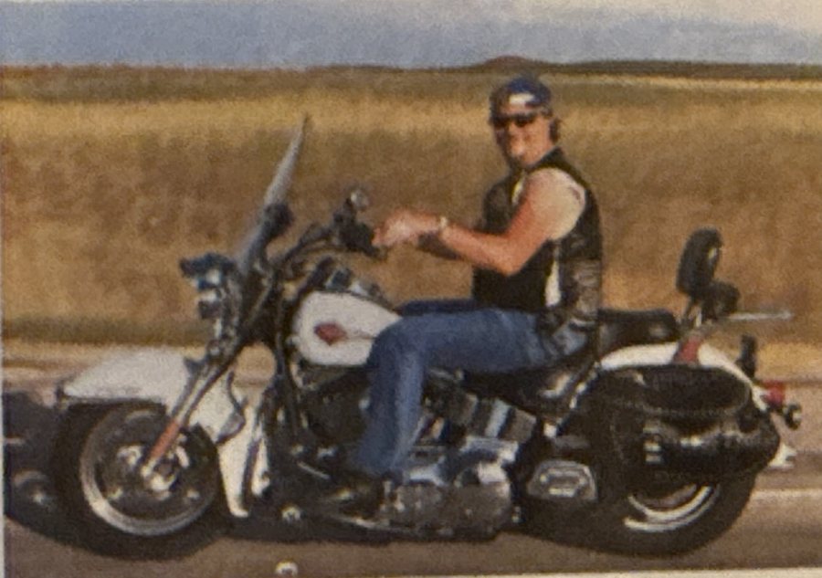 Mike riding his motorcycle on an open highway